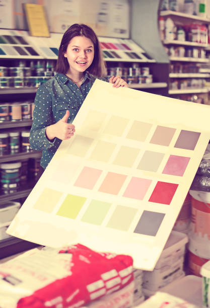 istock Positive woman checking color scheme 693744288