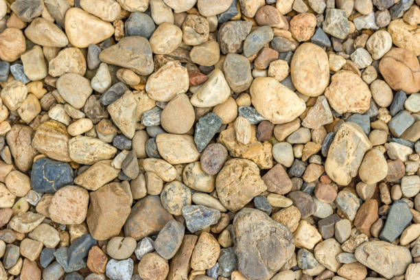 istock Small beautiful colorful pebbles, Multicolored little rocky background. 693744952