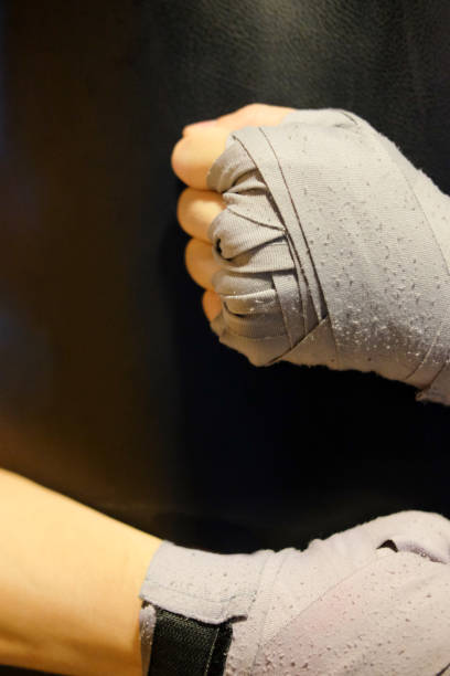 istock Close up hand man hug punching bag 693749018