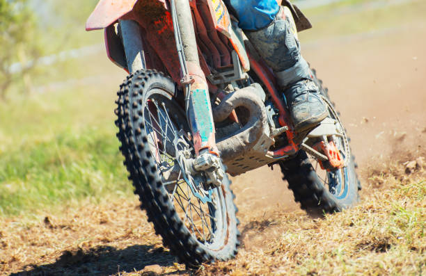istock Professional motocross rider on the road. 693749036