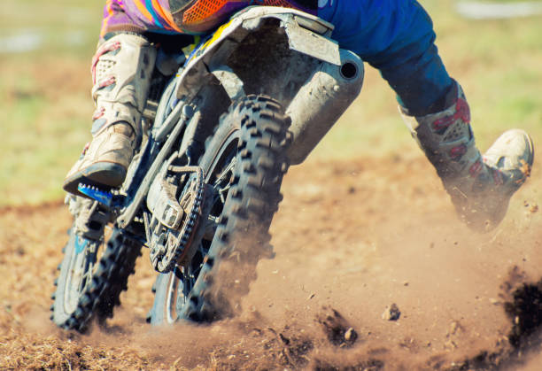 istock Professional motocross rider on the road. 693749038