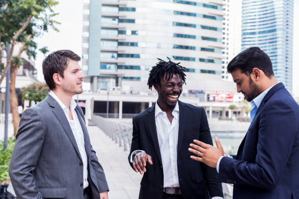 istock Three business associates spending time together after work 693751712