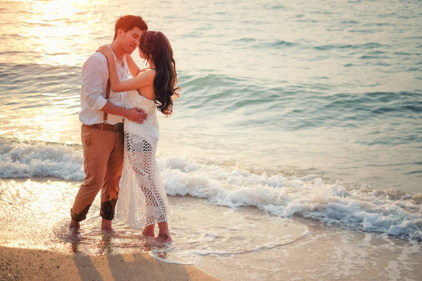 istock Happy couple relaxing and smile on the beach 693751950