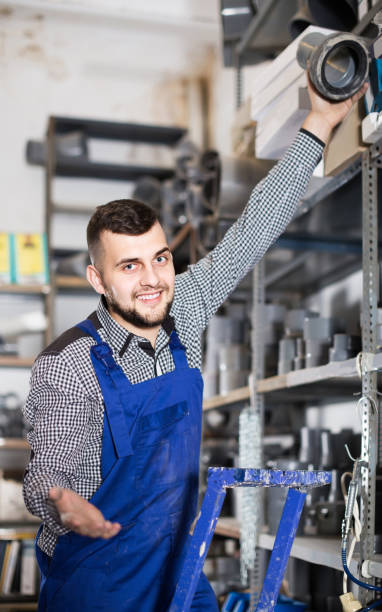 istock male worker showing his workplace at workshop 693752312