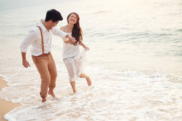 istock Happy couple relaxing and smile on the beach 693752624