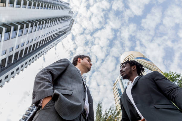 istock Businessmen having a conversation outside their office 693755508