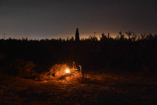istock Candles in the woods at night 693762536
