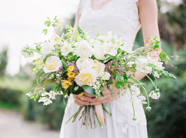 Bride in wedding dress with bouquet. Wedding style.