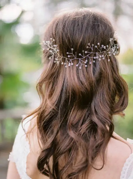 Photo of Hairstyle and accessories of the bride. Wedding style.