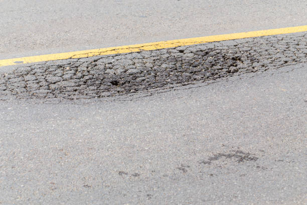 cracked of asphaltic at center of road, selective focus
