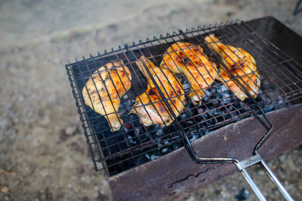 istock fried chicken thighs and wings on fire 693771158