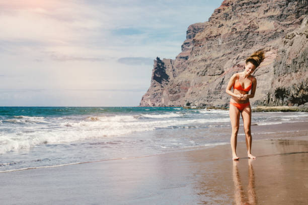istock Young woman on the beach 693771288