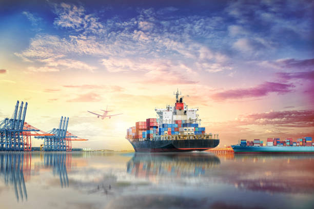 istock Logistics and transportation of International Container Cargo ship and cargo plane in the ocean at twilight sky, Freight Transportation, Shipping 693774520