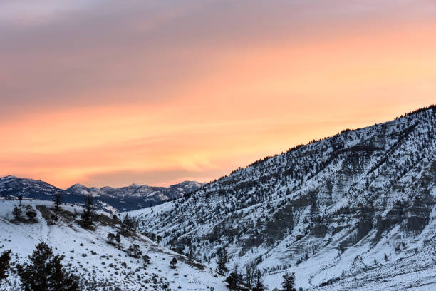 istock Colorful Sky at Sunrise Over Snow Covered Mountains 693775002