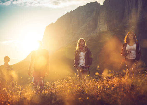 istock Adventures on the Dolomites: friends hiking up mountain 693777584
