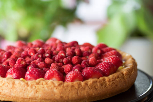 istock wild strawberries as decoration of cheese cake 693780822