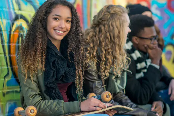 Photo of Smiling With Her Skateboard