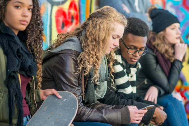 istock Showing Her Friend a Photo 693787476