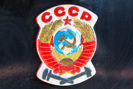Symbol of former state the USSR on the retro steam locomotive