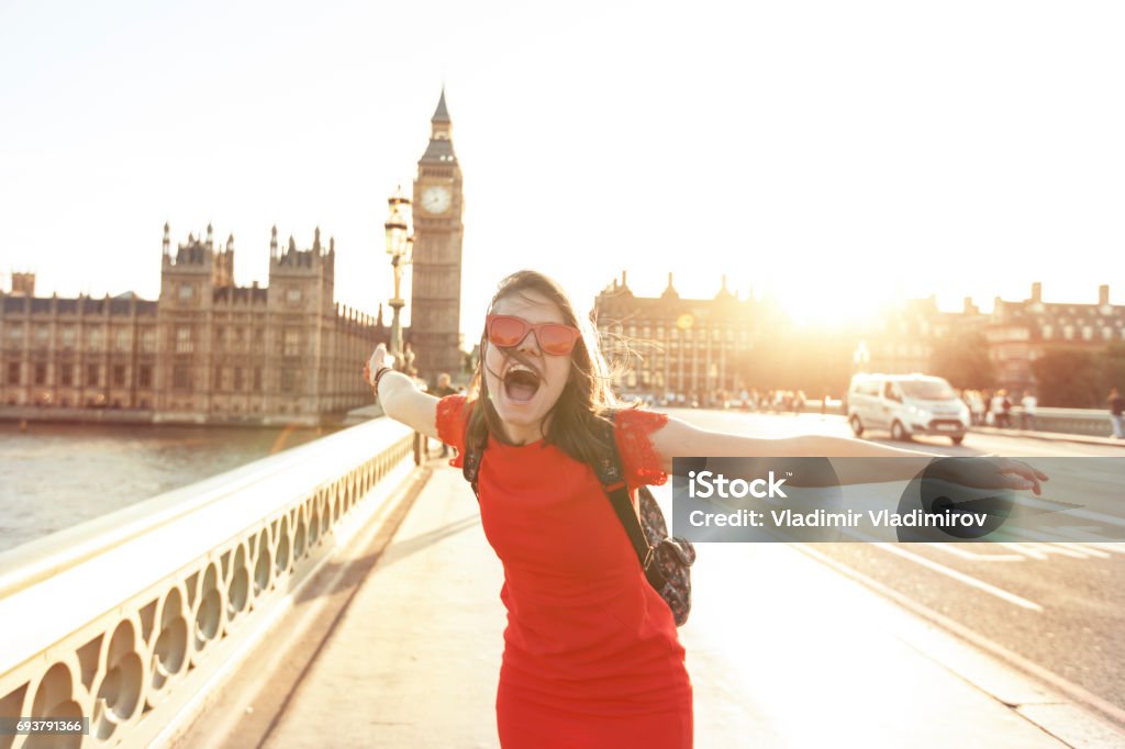 Woman having fun at sunset Woman having fun at sunset at Westminster bridge London - England Stock Photo