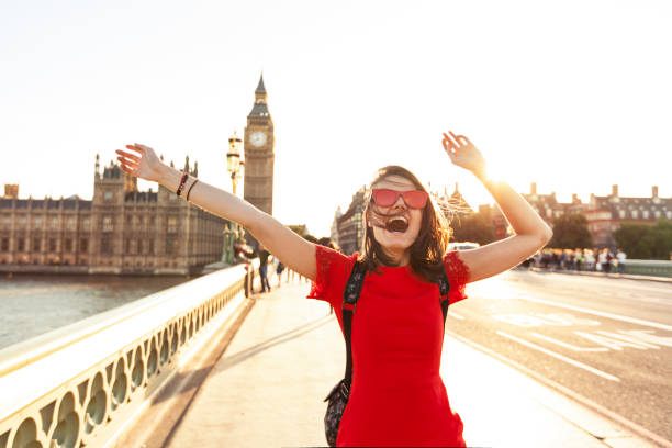 istock Woman having fun at sunset 693791380