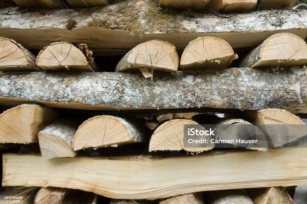 fuelwood stack of hacked wood Firewood Stock Photo