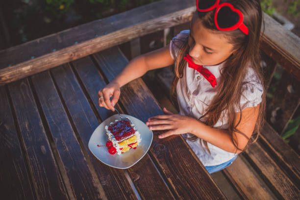 Girl eating birthday cake