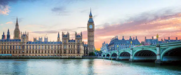 London, UK panorama. Big Ben in Westminster Palace on River Thames at beautiful sunset.