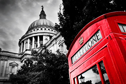 St Paul's Cathedral dome and red telephone booth. Symbols of London, the UK. Black and white