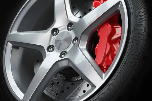 Photo of Car wheel red brakes closeup