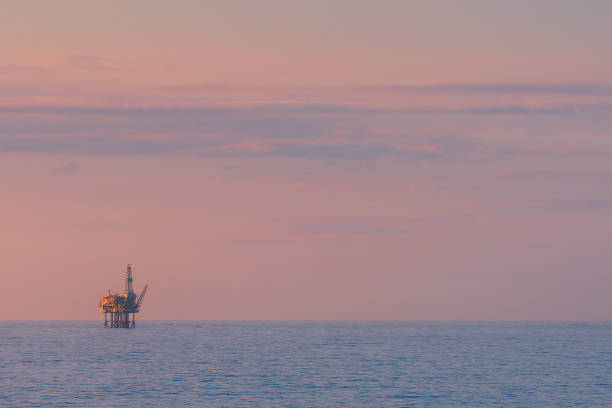istock oil rig drilling platform over sea 693807314