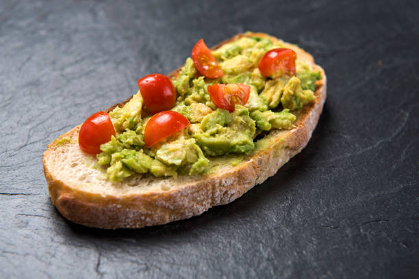 istock Avocado and tomatoes on sourdough bread 693810124