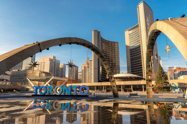 View of Nathan Phillips Square and Toronto Sign in downtown Toronto City Hall and Toronto Sign in downtown at sunset, in Toronto, Ontario, Canada toronto stock pictures, royalty-free photos & images