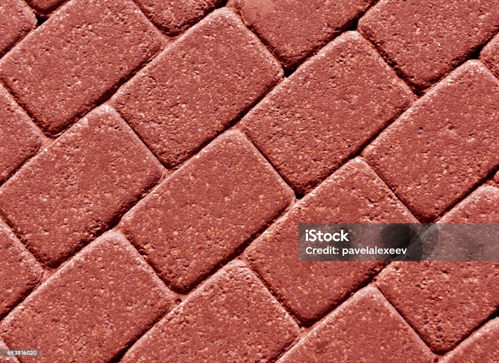 Red color cobblestone pavement surface. Red color cobblestone pavement surface. abstract background and texture for design. Abstract Stock Photo