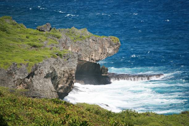 istock jutting rocks above the blue ocean 693816228