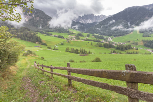 istock Small Italian mountain town in the Dolomites ( St. Magdalena in Val di Funes ) 693820196