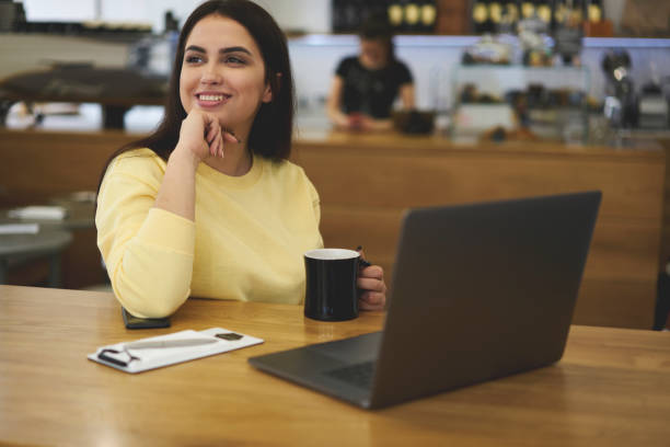 istock Attractive female administrative manager sitting at wooden table 693823258