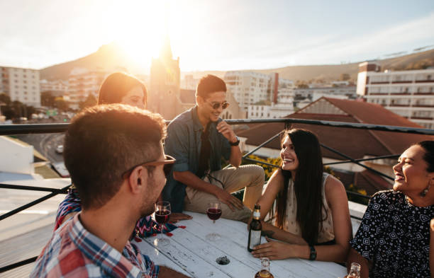 istock Friends having a party on the rooftop 693827014