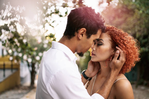 istock Young couple in a sensual pose outdoors. 693830656