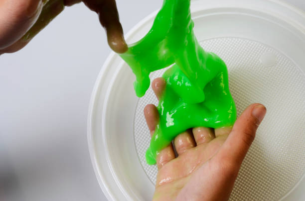 istock Pate slime elastic and viscous on child's hand 693834042