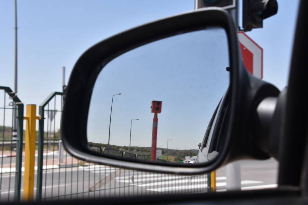 istock Speed camera from the mirror of a vehicle 693834360
