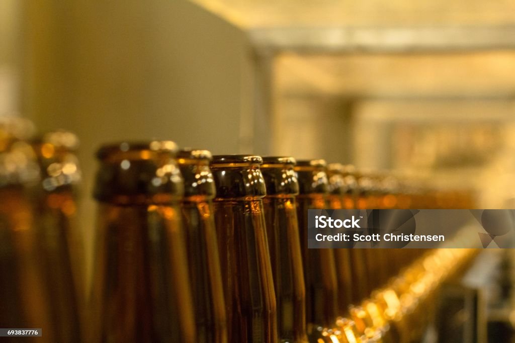 Bottling Line Beer bottles on the bottling line Beer - Alcohol Stock Photo