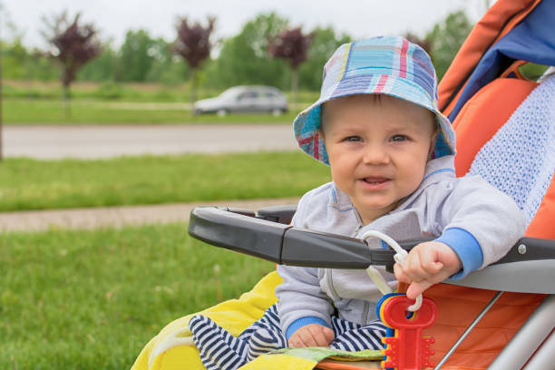 istock Cute baby boy in a stroller 693841580