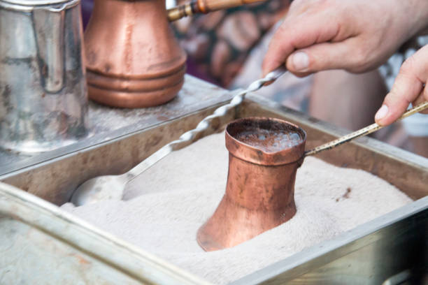 istock coffee preparation in copper pot with hot sand 693841768