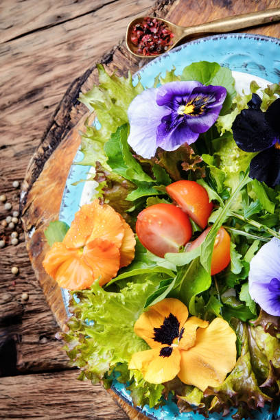 istock salad with herb and flower 693852860