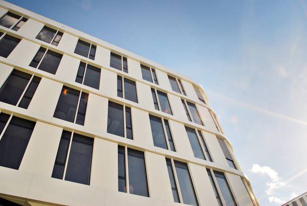 istock Modern building. Modern office building with facade of glass 693868056