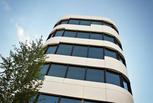 istock Modern building. Modern office building with facade of glass 693874158
