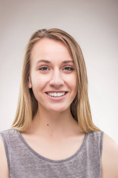 istock candid portrait, one young woman, background 693874258