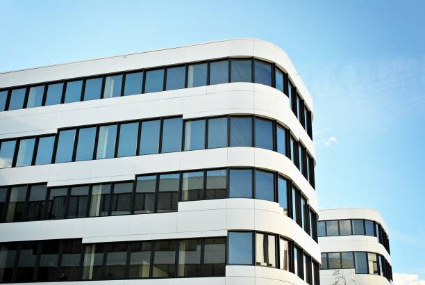 istock Modern building. Modern office building with facade of glass 693874724