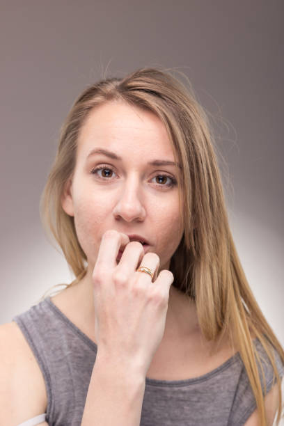 istock one young woman, looking to camera, portrait background 693874750